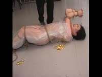 Japanese brunette gets covered in bondage